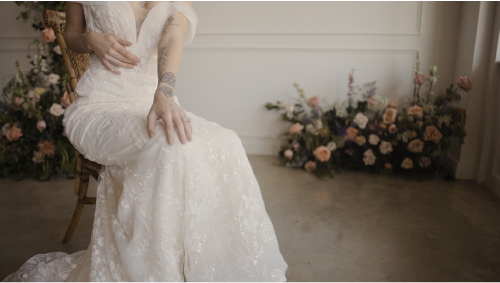 Woman in wedding dress sitting 