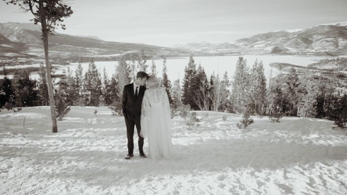 Woman and man posing in the snow black and white